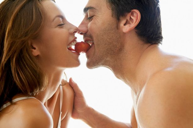 Couple Eating a Strawberry-1146322