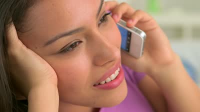 stock-footage-hispanic-woman-using-mobile-phone-in-bed
