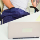 Man with hand in waistband at desk ~ MarriageHeat