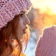 Brunette in pink winter had blows on cold hands ~ MarriageHeat